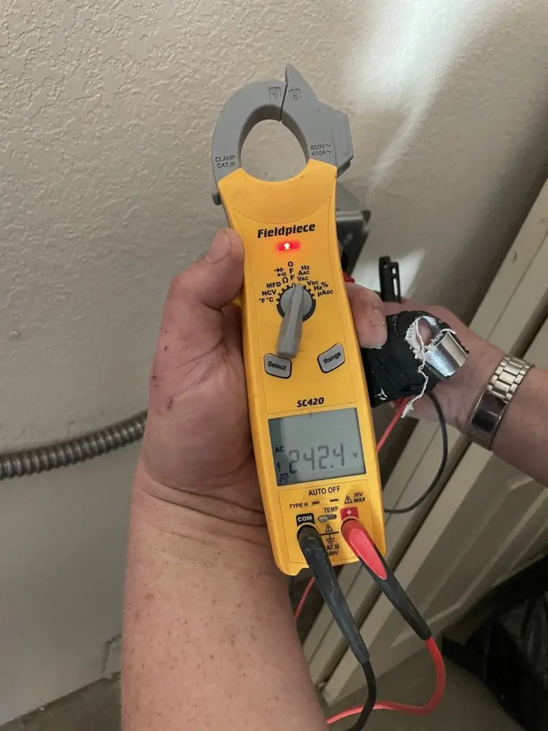 Voltage testing with clamp meter during Electrical Installation Services in Bloomfield